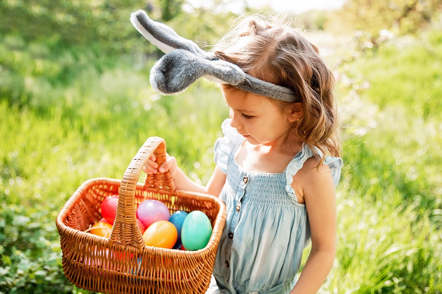 basket full of colorful eggs. Easter egg hunt.