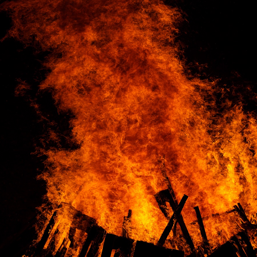 Big fire on the dark background. Huge bonfire at night